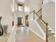 Grand foyer with a staircase, tile flooring, and a high ceiling, creating an open and inviting space at 17117 Cypress Preserve Pkwy, Orlando, FL 32820