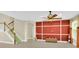 Bright living space featuring tile floors, a staircase, and custom wall paneling for a modern touch at 17117 Cypress Preserve Pkwy, Orlando, FL 32820