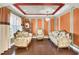 Elegant living room with ornate furniture, recessed lighting, and custom wall paneling at 17117 Cypress Preserve Pkwy, Orlando, FL 32820