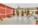 Spacious living area with large windows, tile flooring, and custom wall paneling for added elegance at 17117 Cypress Preserve Pkwy, Orlando, FL 32820