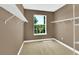 Walk-in closet with carpeting, neutral paint color, and built-in shelving at 17117 Cypress Preserve Pkwy, Orlando, FL 32820
