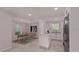 Modern kitchen features an island, stainless steel appliances, and a bright dining area at 17445 Sw 25Th Ct, Ocala, FL 34473