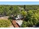 Charming home nestled among lush trees, offering privacy and a serene setting at 210 E Kaley St, Orlando, FL 32806
