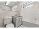 Bright bathroom featuring a vanity with storage, modern fixtures, and a shower over tub with white subway tiles at 210 E Kaley St, Orlando, FL 32806