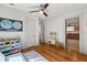 Bedroom featuring hardwood floors, a toy kitchen and view to adjacent room at 210 E Kaley St, Orlando, FL 32806