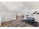 Exercise room featuring hardwood floors and view of adjacent living space at 210 E Kaley St, Orlando, FL 32806