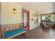 Charming front porch with a bench and rocking chair, perfect for relaxing outdoors at 210 E Kaley St, Orlando, FL 32806