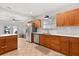 Kitchen featuring stainless steel appliances, white countertops, and natural wood cabinets at 210 E Kaley St, Orlando, FL 32806