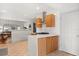 Bright kitchen featuring hardwood cabinets, white backsplash, and stainless steel hood vent at 210 E Kaley St, Orlando, FL 32806