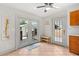 Bright kitchen nook with tile floor, french doors leading to deck, and single door to yard at 210 E Kaley St, Orlando, FL 32806