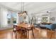 Open concept living space connected to the dining area with hardwood floors and fireplace at 210 E Kaley St, Orlando, FL 32806