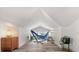 Open living space with hardwood floors, vaulted ceilings, and bright natural light at 210 E Kaley St, Orlando, FL 32806