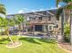 Expansive screened pool and patio area surrounded by lush landscaping, offering privacy and outdoor enjoyment at 2145 Plantation Oak Dr, Orlando, FL 32824
