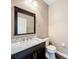 Bathroom featuring a vanity with a marble countertop, a mirror, and tile floors at 2145 Plantation Oak Dr, Orlando, FL 32824