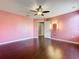 Bedroom featuring hardwood floors, a fan, and lots of natural light at 2145 Plantation Oak Dr, Orlando, FL 32824