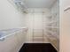 Well-organized walk-in closet with multiple shelving levels, maximizing storage space and convenience at 2145 Plantation Oak Dr, Orlando, FL 32824