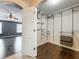 Organized walk-in closet featuring shelving, drawers and connection to main bedroom for convenience at 2145 Plantation Oak Dr, Orlando, FL 32824