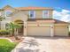 Charming two-story home featuring a 3-car garage and a well-manicured front yard at 2145 Plantation Oak Dr, Orlando, FL 32824