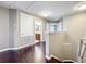 Well-lit hallway with hardwood floors, a bathroom, and bedrooms create a seamless flow to various spaces at 2145 Plantation Oak Dr, Orlando, FL 32824