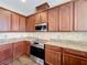 Kitchen featuring stainless steel appliances, stylish backsplash, and dark wood cabinets at 2145 Plantation Oak Dr, Orlando, FL 32824