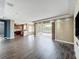 Living room featuring tile floors, an entertainment center, and access to a pool at 2145 Plantation Oak Dr, Orlando, FL 32824