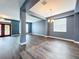 Spacious living area with a view of the front door and dining room, featuring wood floors at 2145 Plantation Oak Dr, Orlando, FL 32824