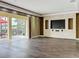 Spacious living room featuring modern entertainment center and seamless indoor-outdoor flow at 2145 Plantation Oak Dr, Orlando, FL 32824