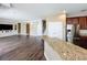 Open living room showing stairs, kitchen access and living area at 2145 Plantation Oak Dr, Orlando, FL 32824