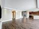 Bright, open-concept living room with recessed lighting and hardwood floors throughout at 2145 Plantation Oak Dr, Orlando, FL 32824