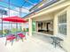 Covered patio with outdoor dining area, opening up to the home's interior at 2145 Plantation Oak Dr, Orlando, FL 32824
