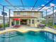 Backyard pool with ample patio space and seating, perfect for outdoor entertaining and relaxation at 2145 Plantation Oak Dr, Orlando, FL 32824