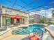 Screened backyard pool area with dining and lounge seating, ideal for enjoying the Florida lifestyle at 2145 Plantation Oak Dr, Orlando, FL 32824