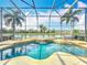 Beautiful screened-in pool with lush landscaping and waterfront views at 2145 Plantation Oak Dr, Orlando, FL 32824