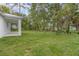Large grassy backyard with mature trees, offering privacy and space at 2259 3Rd Ave, Deland, FL 32724