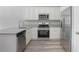 Stylish kitchen featuring stainless steel appliances, granite countertops, and ample cabinet space at 2259 3Rd Ave, Deland, FL 32724