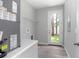 Spacious laundry room featuring wood-look flooring and access to the backyard at 2259 3Rd Ave, Deland, FL 32724