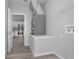 Bright laundry room with gray walls, wood-look floors, and storage space with gray HVAC system at 2259 3Rd Ave, Deland, FL 32724