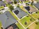 Aerial view of single Gathering home with solar panels and manicured lawn at 2331 Kennington Cv, Deland, FL 32724