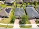 Aerial view of single Gathering home, solar panels, and well-maintained lawns at 2331 Kennington Cv, Deland, FL 32724