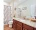 Inviting bathroom with granite countertops and a decorative shower curtain at 2331 Kennington Cv, Deland, FL 32724