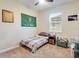 Small bedroom features carpeted floors, a window, and a U.S. Army Flag at 2331 Kennington Cv, Deland, FL 32724