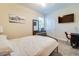 Cozy bedroom featuring carpeted floors, a closet, and a television at 2331 Kennington Cv, Deland, FL 32724