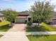Charming single-Gathering home with brick driveway and well-manicured landscaping at 2331 Kennington Cv, Deland, FL 32724