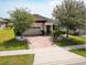 Charming single-Gathering home with brick driveway and well-manicured landscaping at 2331 Kennington Cv, Deland, FL 32724