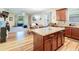 Open concept kitchen with an island flowing into the dining and living area at 2331 Kennington Cv, Deland, FL 32724