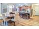 Eat-in kitchen features stainless steel appliances, bar stool seating, and light wood flooring at 2331 Kennington Cv, Deland, FL 32724