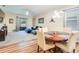Bright living area with a dining table and a comfortable blue sectional sofa at 2331 Kennington Cv, Deland, FL 32724