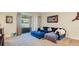 Cozy living room with a plush blue sectional and access to the outdoor patio at 2331 Kennington Cv, Deland, FL 32724