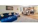 Open floor plan living space with a comfortable blue sofa and modern decor at 2331 Kennington Cv, Deland, FL 32724