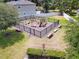 Community playground with climbing structures, benches, and safety surfacing at 2331 Kennington Cv, Deland, FL 32724